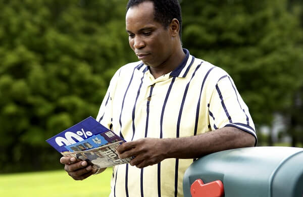man reading marketing newsletters